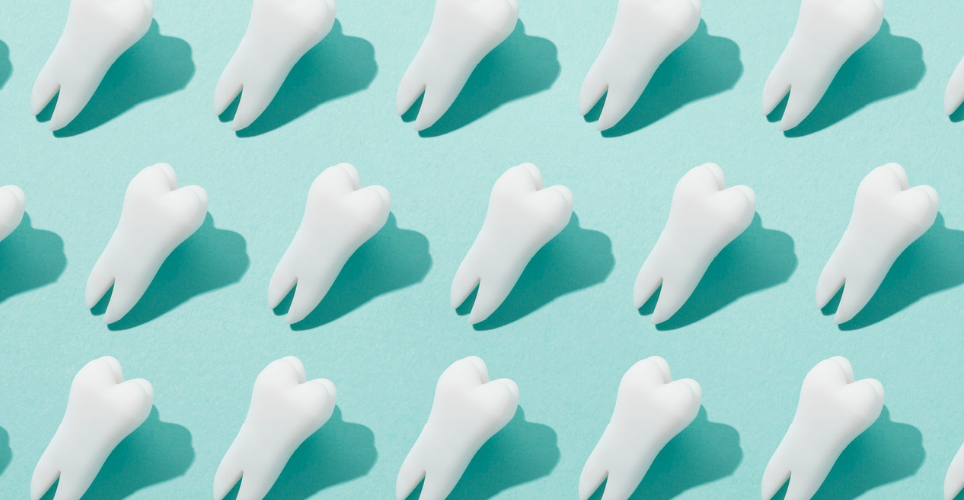White teeth on a teal background. 