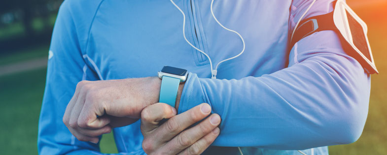 man looking at his smart watch