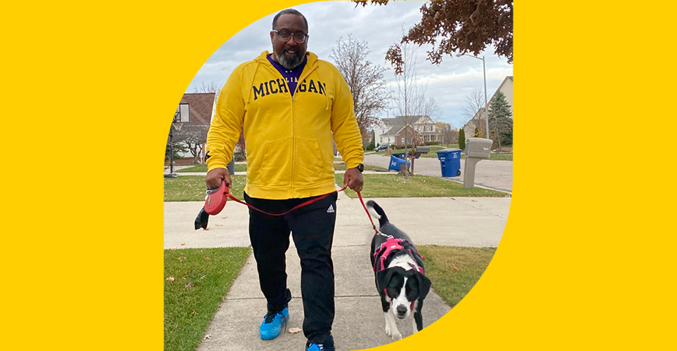 Dr. Steven Gay, Asst. Dean for Admissions, Medical School, walking his dog Coco.