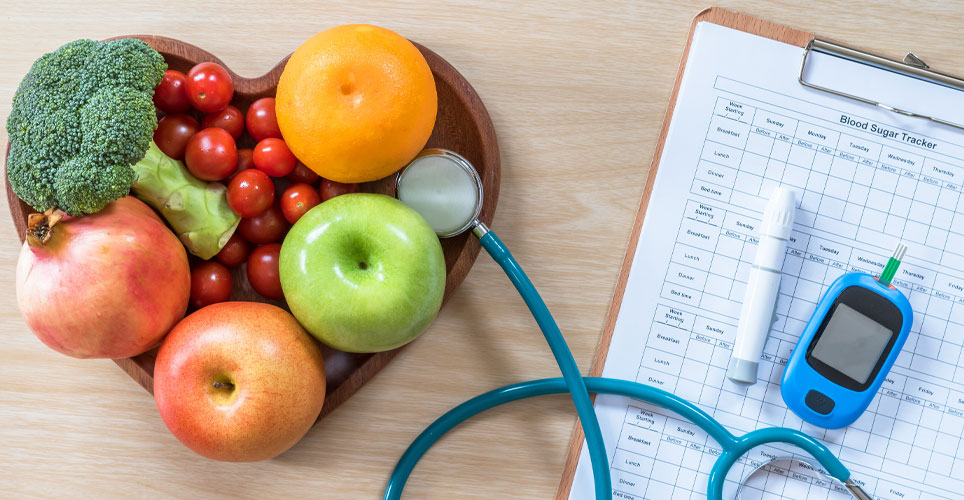 assorted fruit, stethoscope and glucose monitor