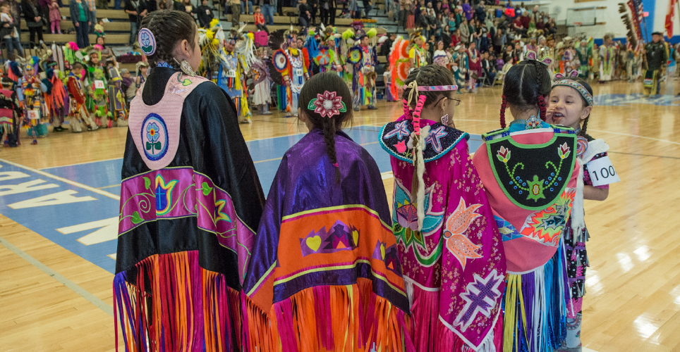 Group of Native American children in traditional dress.