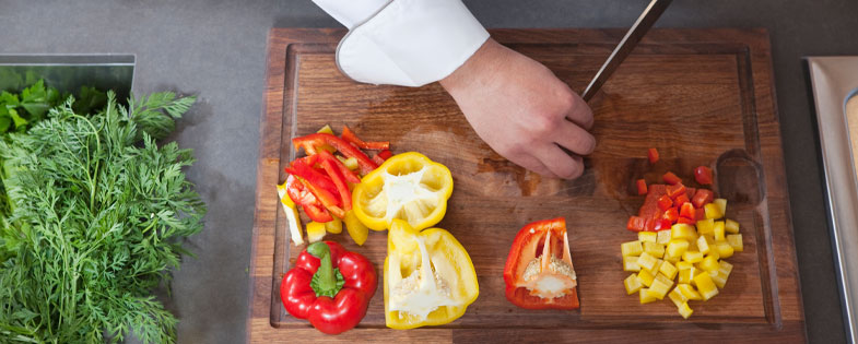 man chopping bell peppers