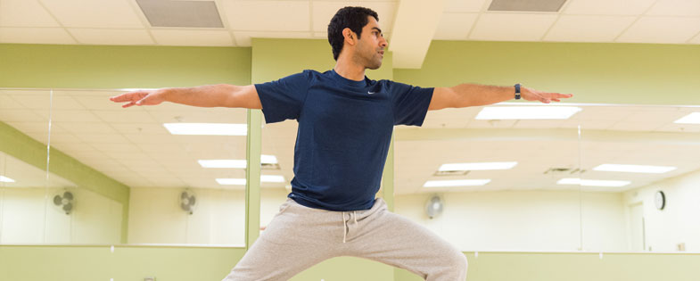 man holding yoga pose