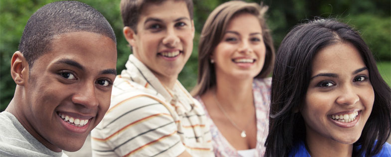 4 smiling teens