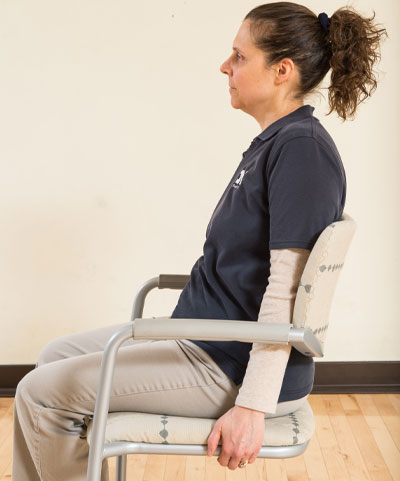 woman sitting on chair - head up