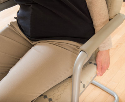 close up of lap of woman sitting in chair