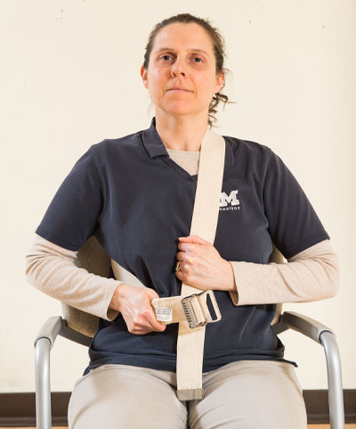 woman sitting in chair looking at camera