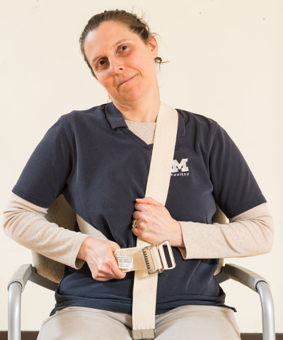 woman sitting in chair with head tilted to the side