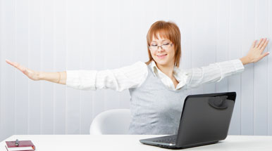 Woman stretching at desk