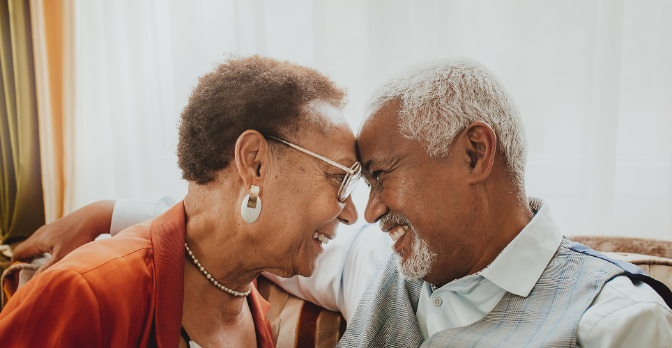 Close up of woman and man of color touching foreheads